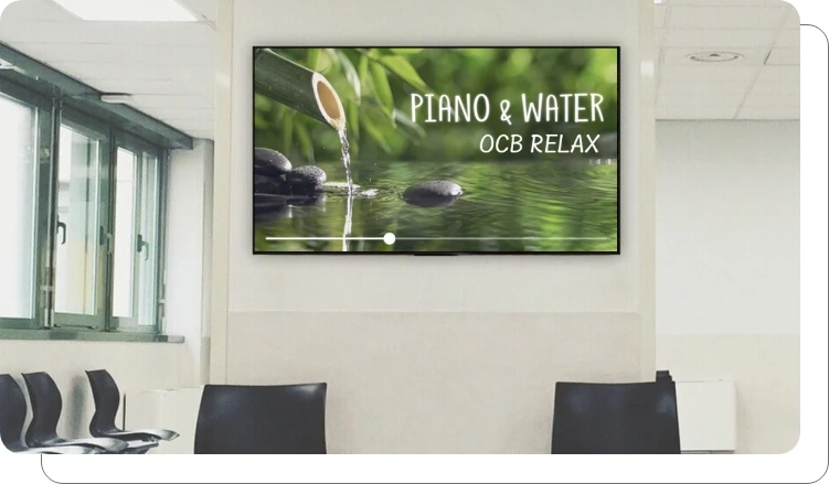 A digital signage screen showing client reviews in an office A digital signage screen showing client reviews in an office
